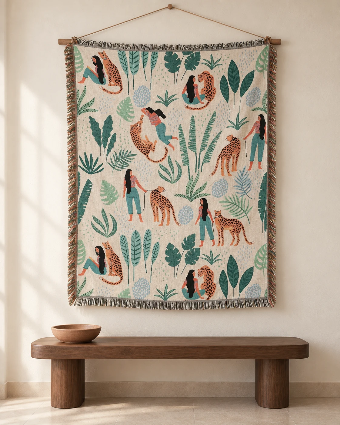 Women and orange leopards among tropical leaves on a cream woven tapestry