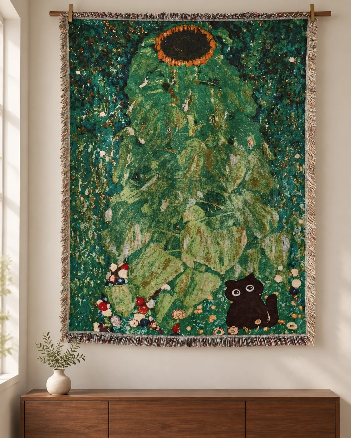 Huge central green sunflower stem and foliage, orange-ringed dark flower at top, small black round-eyed cat bottom right, deep teal background